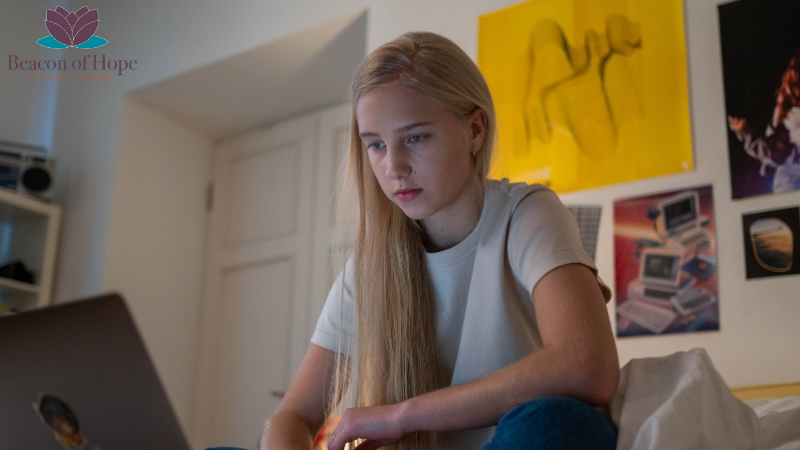 Young teen on a laptop